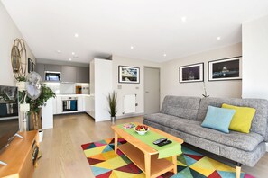 Contemporary open plan kitchen lounge with all mod cons for a comfy stay in