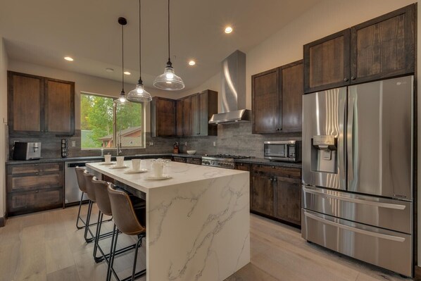 Kitchen area with stainless-steel appliances and spacious island