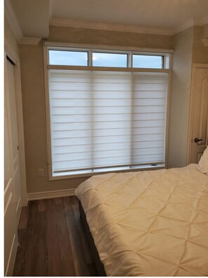 Master bedroom with blinds closed.