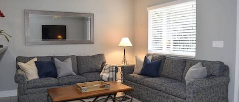 Comfy living room with plenty of seating for 4 guests