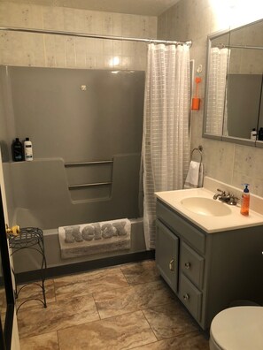 Bathroom with tub and shower