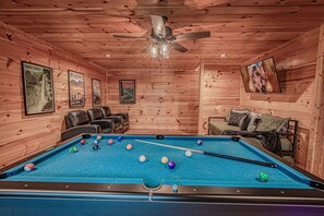 Game room with theater setup and arcades