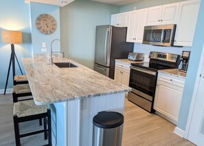 New marble kitchen countertops, stainless appliances & 3 counter stools.