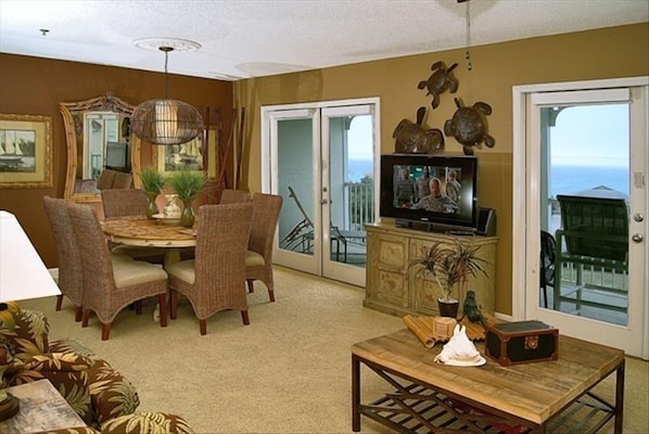 Gulf views through the french doors and balcony.  Carpet replaced with hardwood.