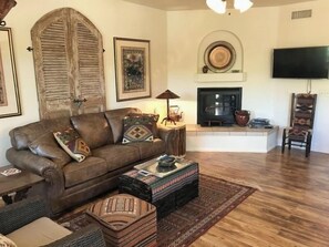 There is a cozy gas fireplace for extra warmth and a flat screen TV for entertainment
