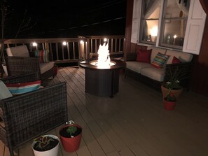 Propane fire pit on deck. Full tank of propane provided.