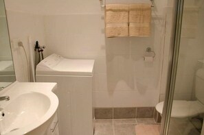 bathroom with washing machine
