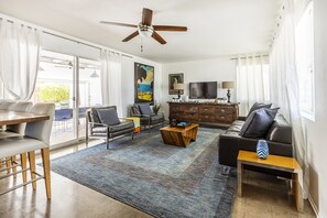 Bright and Fresh Living Room with Comfortable Seating and Roku TV