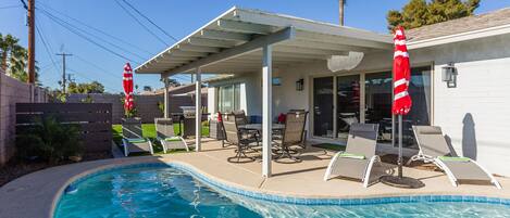 Private backyard with recently resurfaced private pool with brand new pool lights.