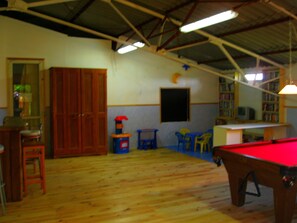 Indoor games room with billiards, toys, games, Disney videos and books.