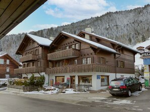 Sky, Cloud, Building, Property, Window, Snow, Mountain, Wheel, Vehicle