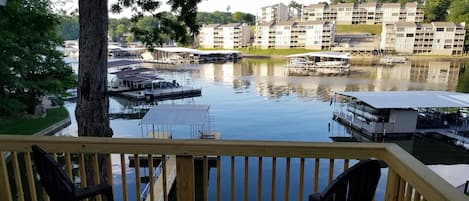 Private Deck overlooking the lake with overhead tiki lights. 