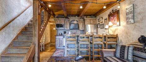 Cozy bar stools by the kitchen bar table, perfect for breakfast.