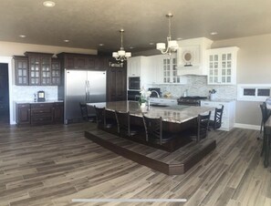 Large Kitchen with oversized fridge and freezer. 