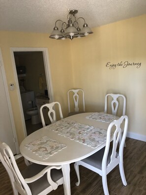 Large dining table with extra chairs seating for 6