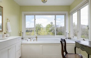 Master bathroom with separate shower and soaking tub. Mountain & garden views.