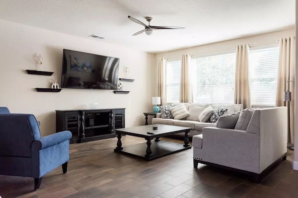 Open living room with 75 inch smart TV