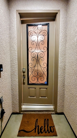 Front door with keyless entry, code provided prior to arrival