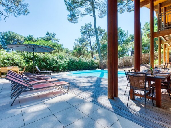 Plant, Furniture, Property, Sky, Table, Shade, Swimming Pool, Tree, Outdoor Furniture, Architecture
