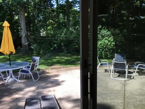 Spacious private yard with new patio furniture and fire pit.