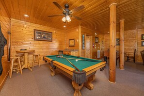 Pool, anyone? Also additional seating around a high top table and a mini fridge.
