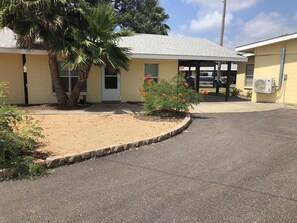 Cottage 4 with private carport and shady palm - new outdoor seating coming soon!