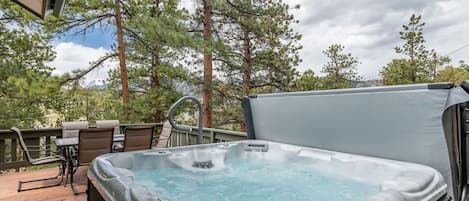 Relax in the spacious hot tub, enjoy views, BBQ and wildlife on the patio.