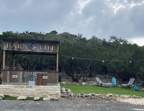 Bar and lounging and corn hole area