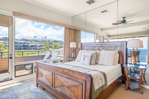 The upper floor bedroom offers a private lanai.