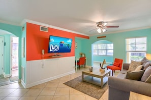 Living Room with Full Size Sleeper Sofa, Smart TV, and Workspace