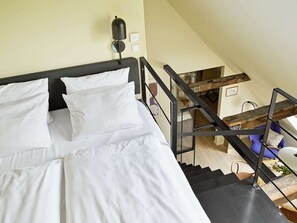 The second double bed is located upstairs