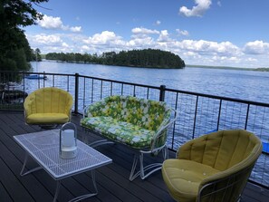 Private deck with seating overlooking the water