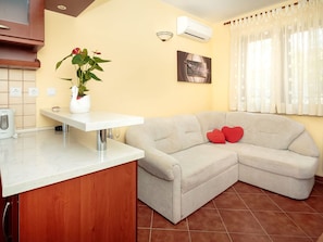 Furniture, Room, Property, Interior Design, Living Room, Floor, Wall, Couch, Table, Building