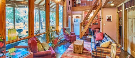 Lodge:  Architecturally magnificent Living Room, Kids Nook & out floor-ceiling windows to outside living area & woods. Glance up to loft & right to bedrooms doors. Click link in photo for video walk-thru & floorplans.