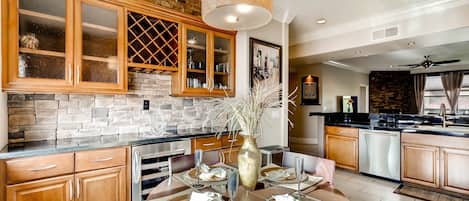Elegant dining room with wine and beverage center.