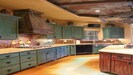Kitchen with under island double ovens, & microwave