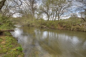 You will easily feel a world away, secluded along the Creek Banks of this retreat