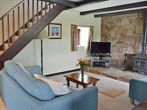 Tastefully furnished living area with wood burner | Barncott - Trewellard Manor Farm, Trewellard, near Penzance