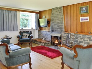 Spacious living area with open-fire | The Old School House, Portpatrick, near Stranraer