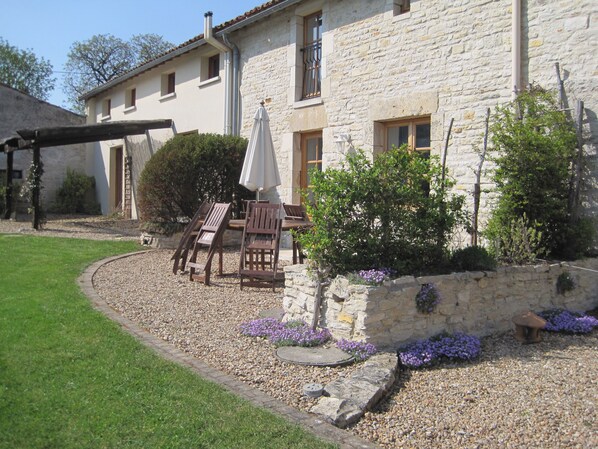 Terrace areas of cottages open out onto the shared gardens