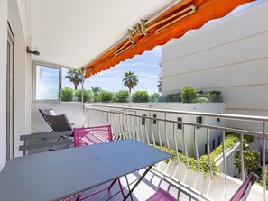 terrace quipped, dining table, sunchairs and small sea view 