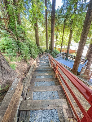 view of stairs and first landing with hammock