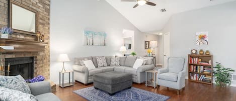 Warm, inviting living room w/ comfy sofas & chairs and plenty of room to relax 