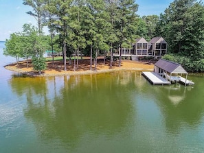 View of the house, boat house, and private point from Lake Gaston