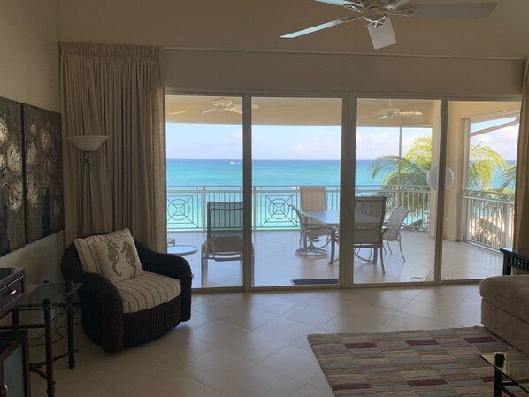 Seven Mile Beach view from the living room, looking through the screened patio.