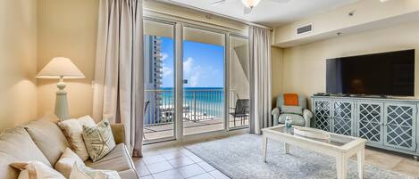 Living room with sleeper sofa and balcony access