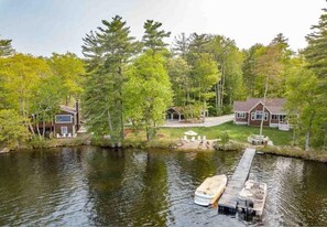 Aerial view from lake of both homes and shared carport.