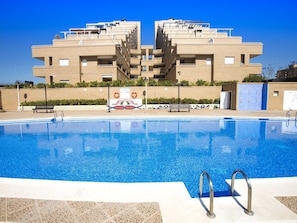 Water, Sky, Building, Blue, Swimming Pool, Azure, Shade, Condominium, Leisure, Outdoor Furniture