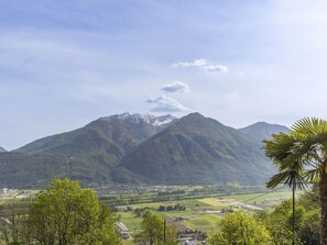 Cloud, Sky, Mountain, Tree, Plant, Highland, Natural Landscape, Mountainous Landforms, Cumulus, Grassland