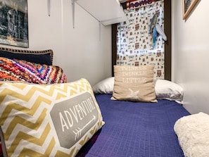 Twin bed for either a child or adult on the main floor.